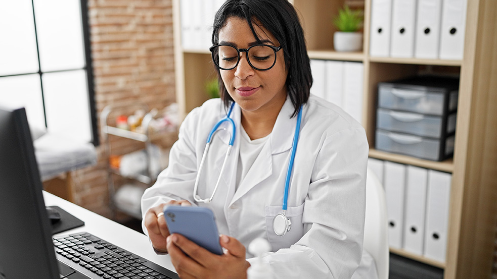 photo of a clinician using a mobile device