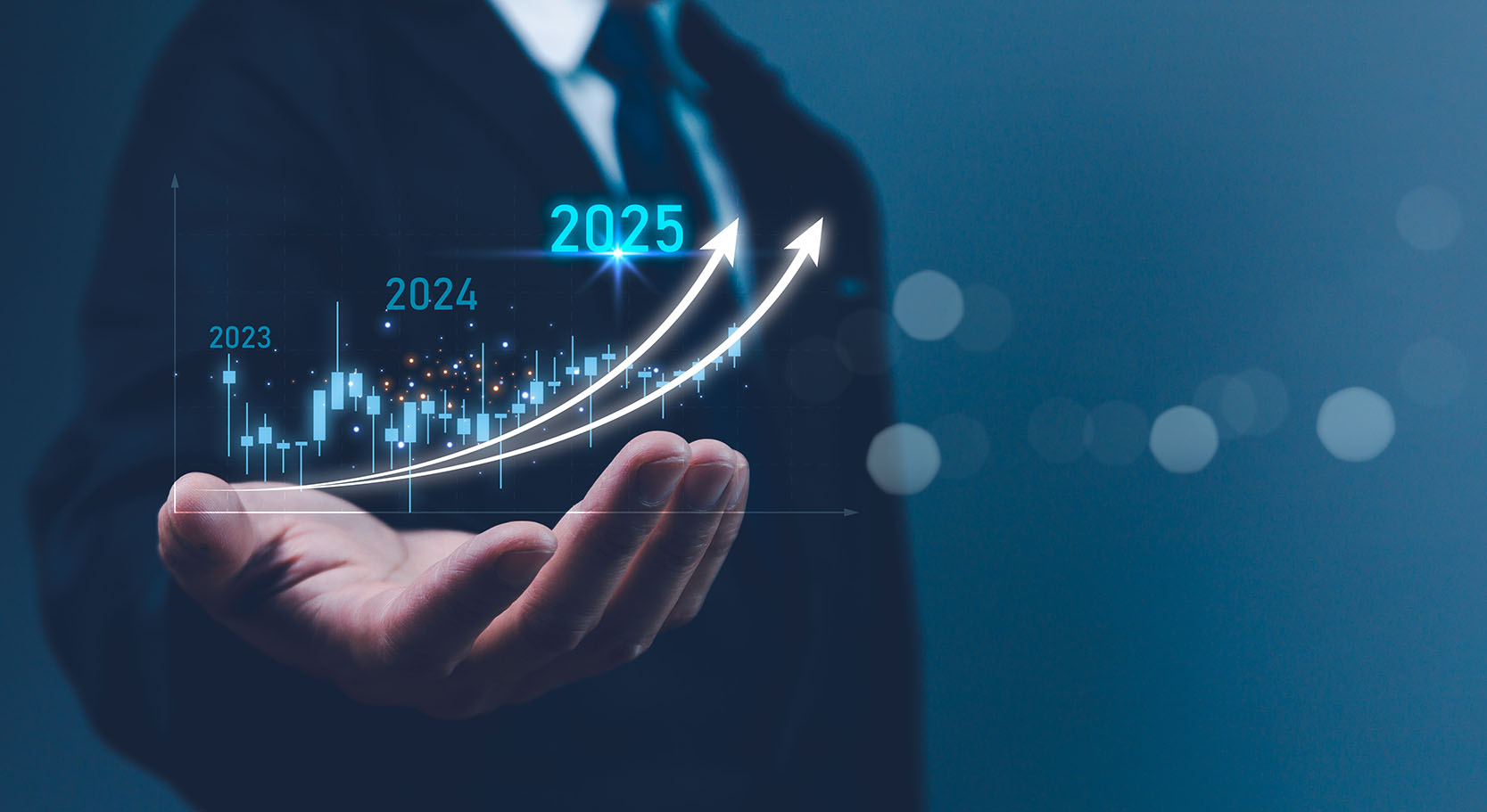 Photo of businessman holding 2025 trends graphic